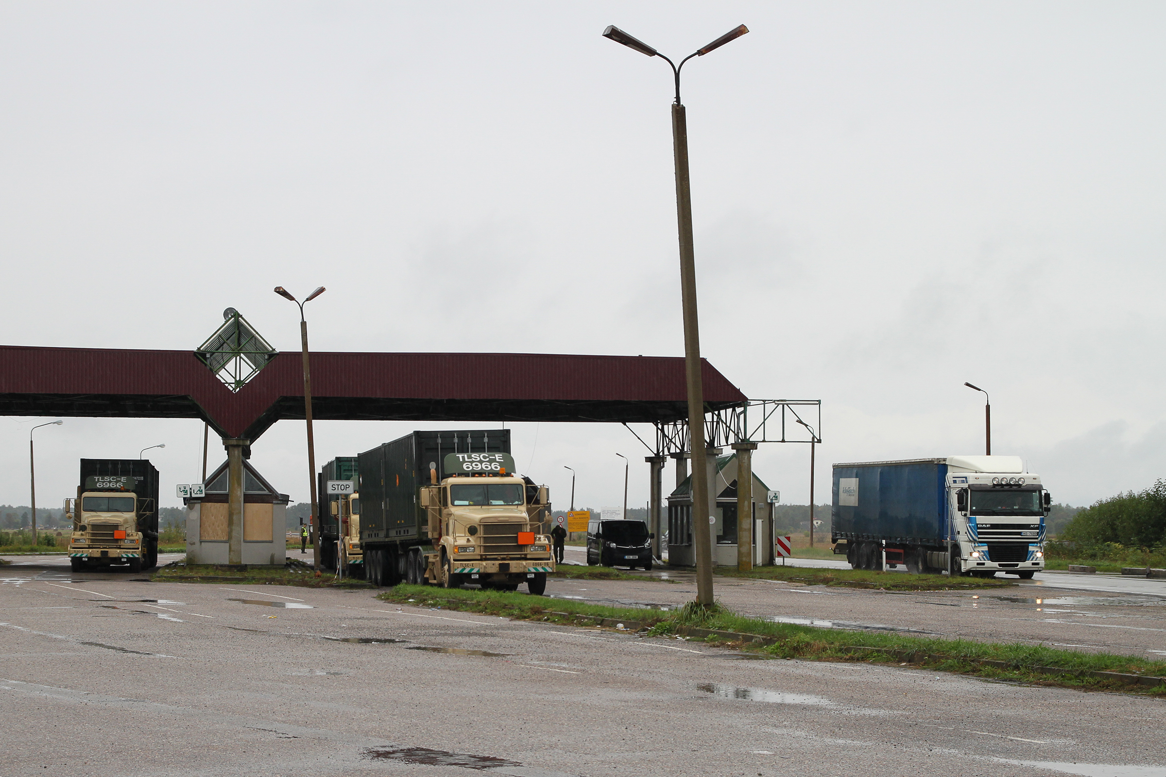 Corridor 1. E67 Adaži, Latvia: Triggered by the fear of a potential Russian invasion, NATO shows significant presence in Baltic nations. Here a convoy of NATO trucks heading north, stops at an abandoned border station.