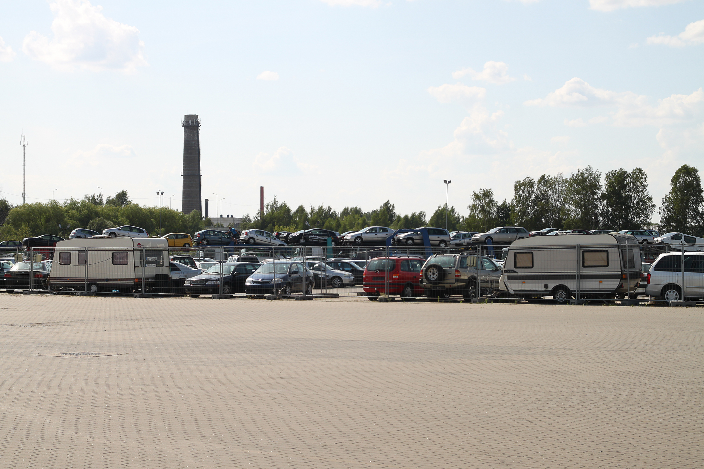 Corridor 1. A5 Marijampole, Lithuania: a second hand car market with cars “collected” in Western Europe and sold directly from the transporter to end consumers or dealers—who then transport them further to other post-Soviet regions using the Russian railway tracks with its wider gauge, which starts from here.